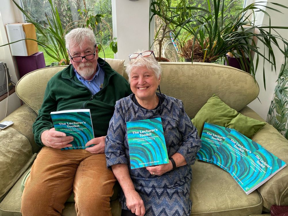 Sally Brown and Phil Race holding copies of the sixth edition of the lecturer’s tool kit published by Routledge