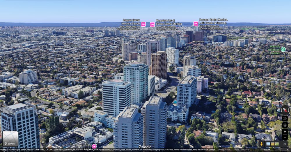 High-rises lining Wilshire Boulevard in Westwood, LA, flanked by a large expanse of low-rise, single-family homes on either side.