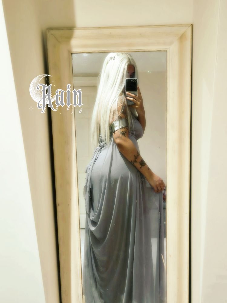 Mirror selfie of rain in a long grey gown and white/silvery long hair