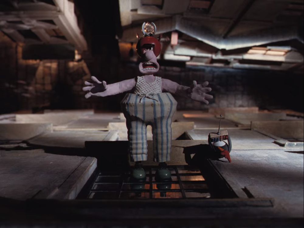 Wallace wearing the wrong trousers being controlled by Feathers McGraw to steal a diamond