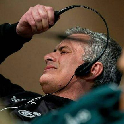 Mourinho removing his headphones in disgust
