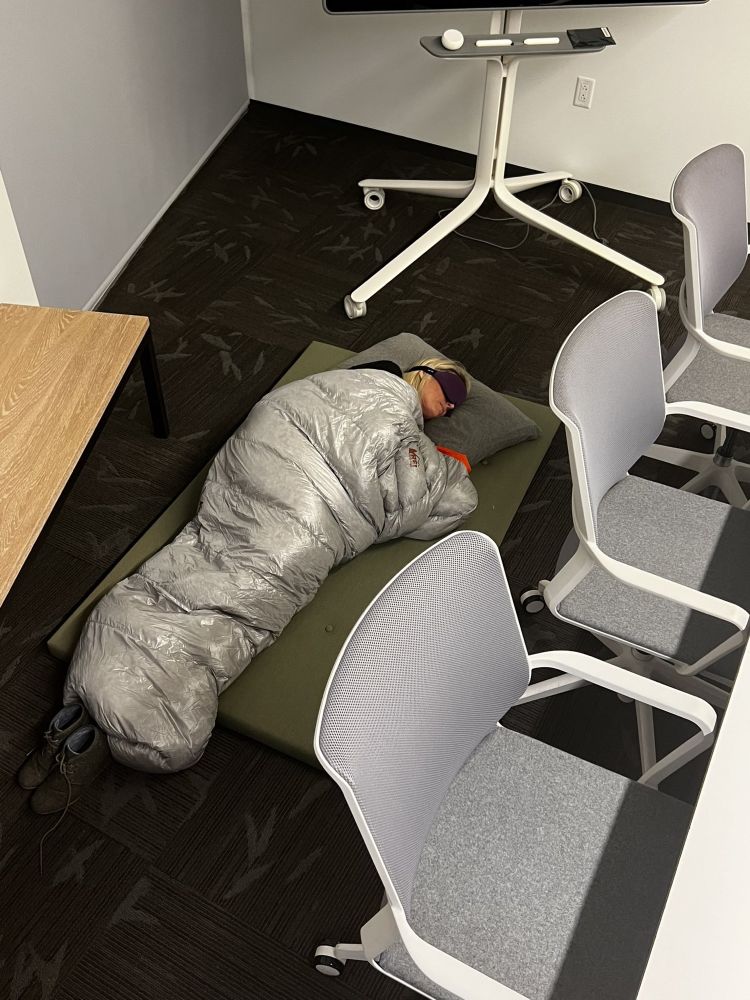 Twitter employee sleeping on the office floor