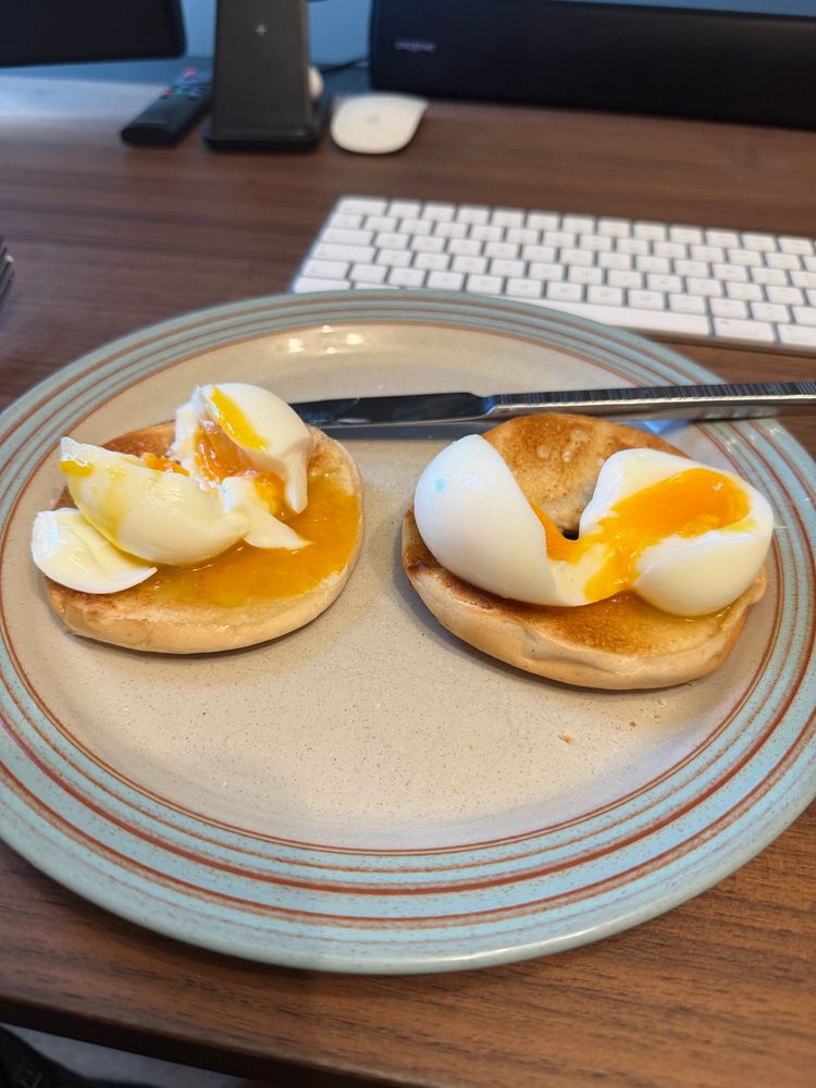 Two boiled eggs on a bagel 