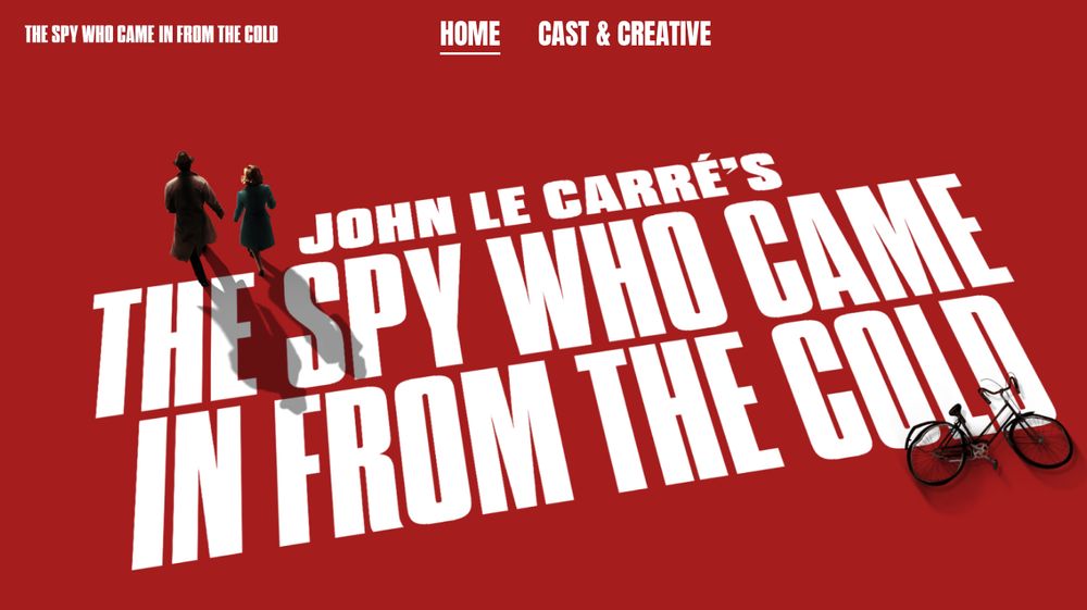 Screencap of the spy onstage.com website landing page - red background, white title text on the diagonal low left to top right. Two figures casting shadows top left: a man and a woman in long coats. Bottom right: a broken bicycle.