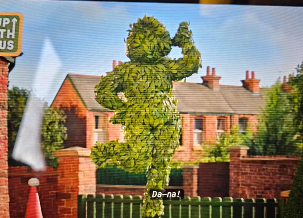 A scene in vengence most fowl looking suspiciously like eric morecambe in his being me sunshine pose