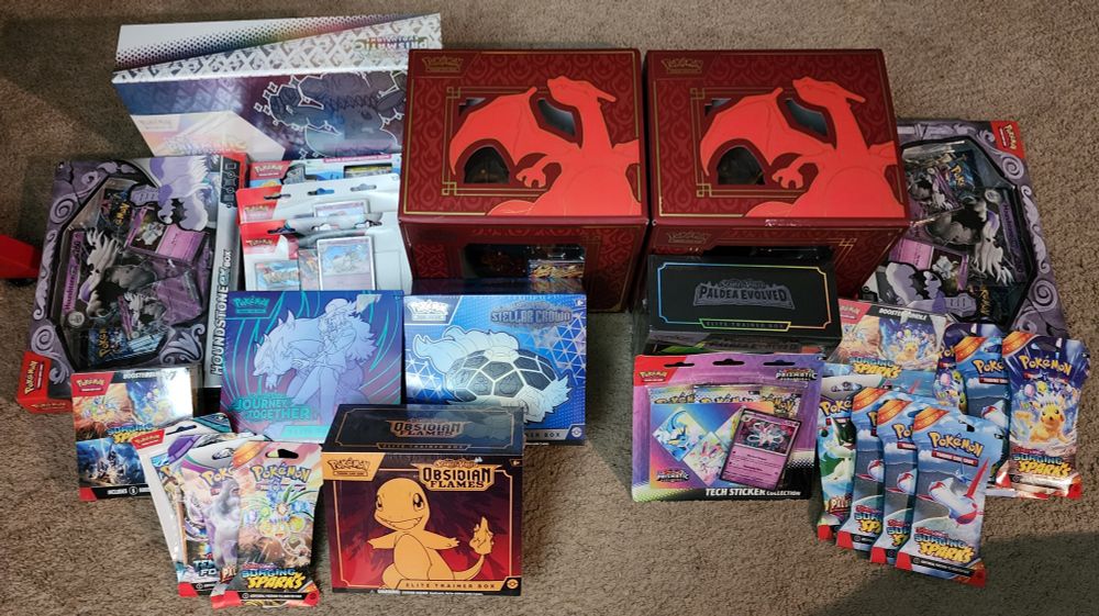 A photo showing many sets of Pokémon Cards that will be opened on stream