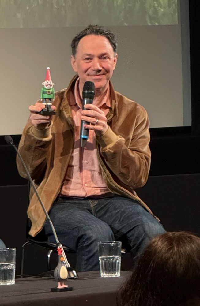 Reece Shearsmith holds up a Norbot puppet for which he provided the voice. 