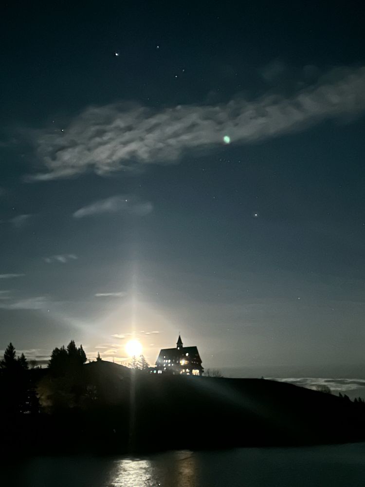 moon rises over the prince of wales hotel in Waterton, Alberta