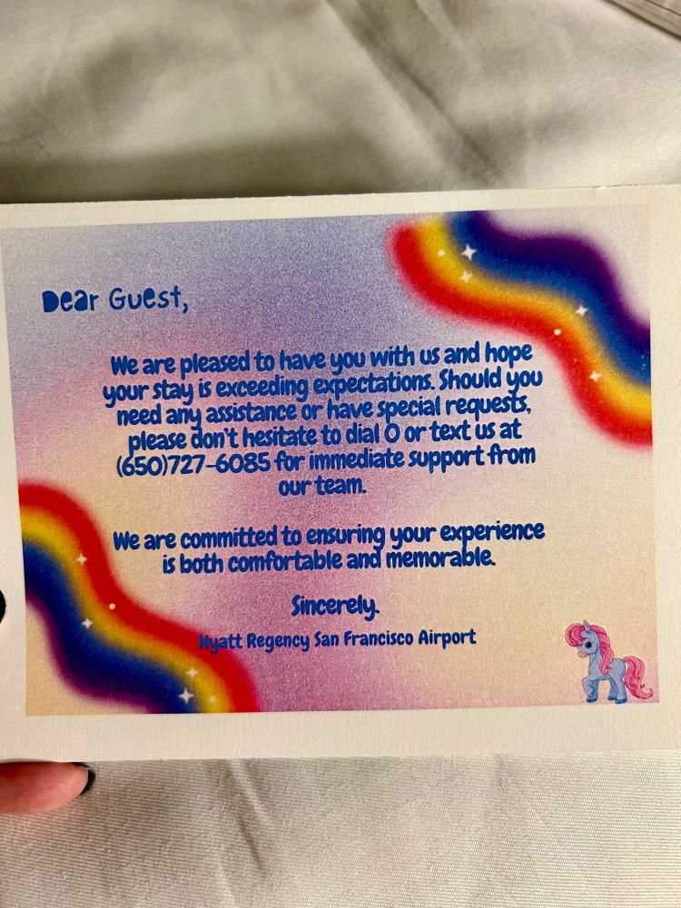 a photo of a note from the Hyatt San Francisco Airport to guests. The note is decorated with rainbows and a tiny pony clip art in the corner.