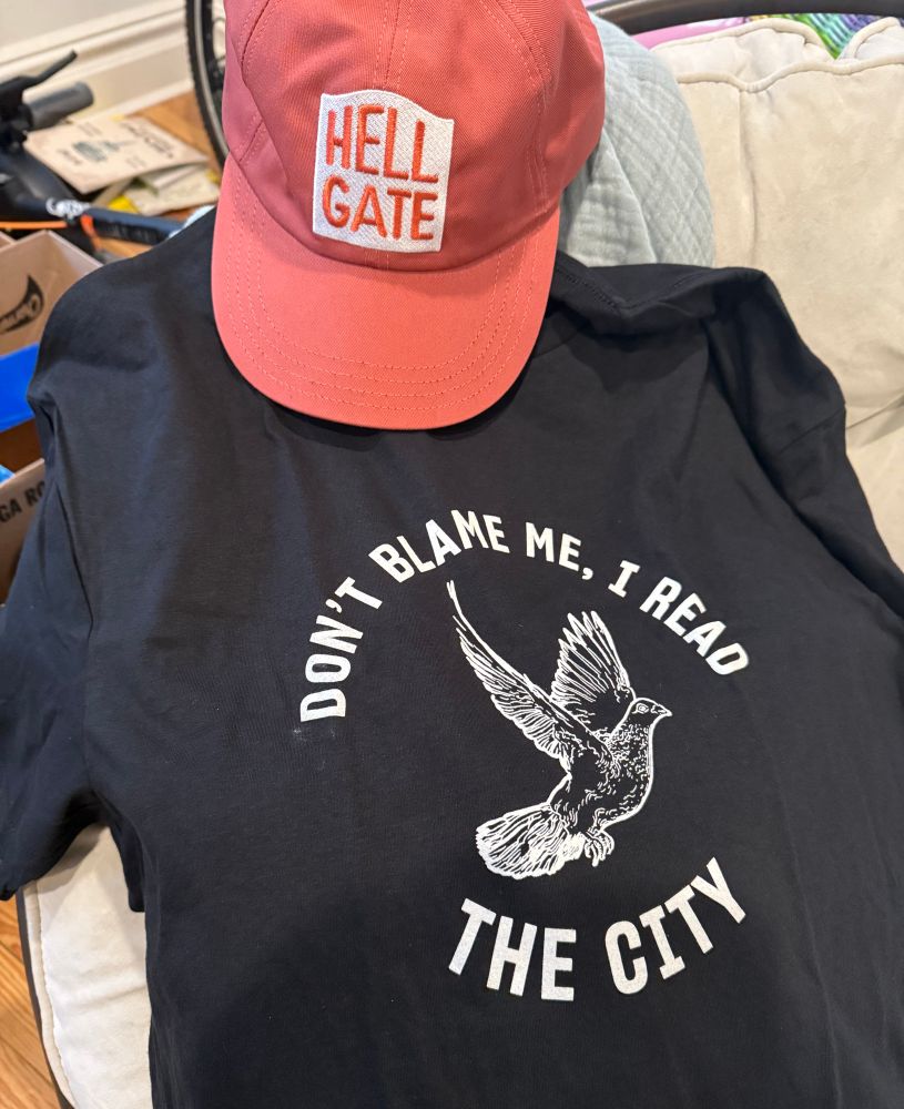 A Hell Gate baseball cap and a T-shirt with “don’t blame me I read the city”