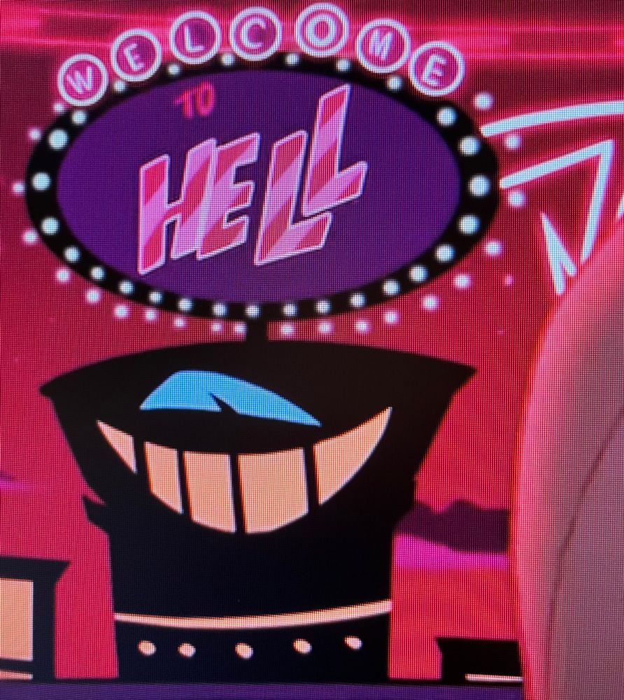 A shot from the Hazbin Hotel pilot of a building with a neon sign that reads “Welcome to Hell”