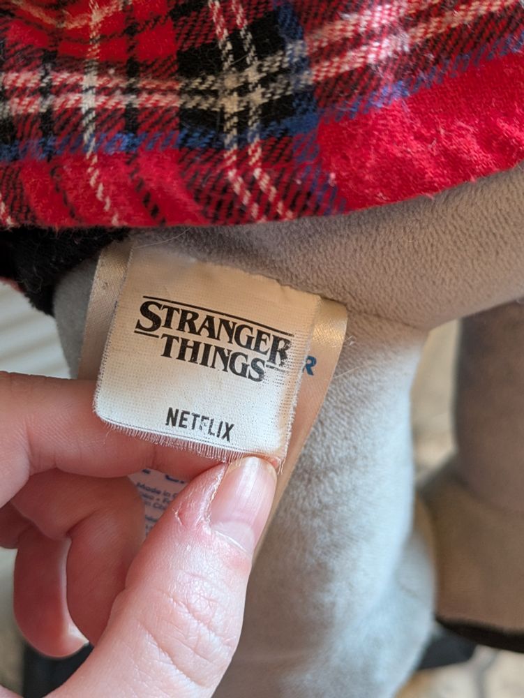 Stranger Things butt tag, fraying around the edges