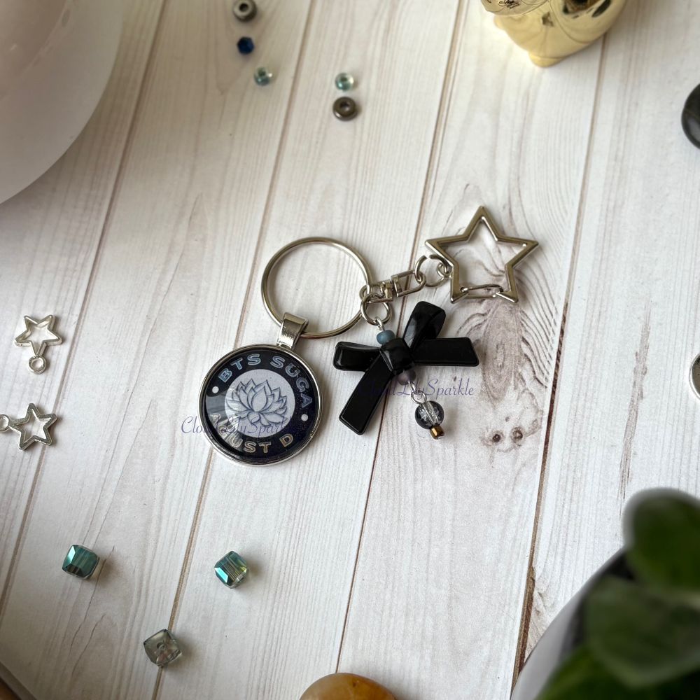 Handmades keychains by CloudLily. Printed artwork and designs in resin  sealed glass domes. Available at CloudLilySparkle.Etsy.com