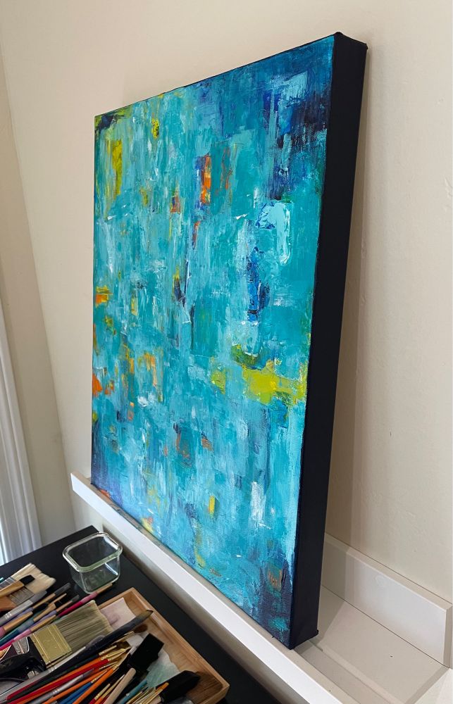 Same 16x20 abstract painting as in the first picture but shown slightly from the side, which is 1.5 inches wide and painted a deep, dark blue.