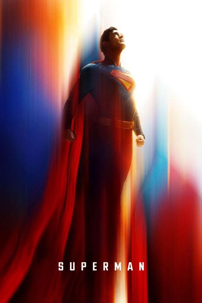 Movie poster for Superman, depicting the title character flying upwards. The background looks like an aurora of his costume's colors; red, blue and yellow