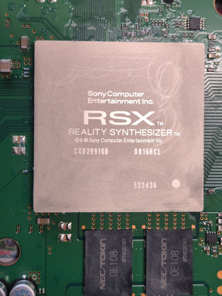 A close-up photo of the RSX graphics chip of a PlayStation 3 Game Console.