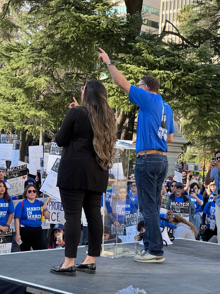 Me on a stage at the steps of the ca capitol speaking to rally goers. 