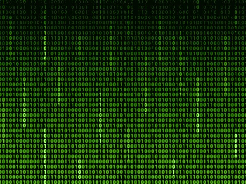 a video screen of with a MATRIX of green letters, some are falling from the top to the bottom.