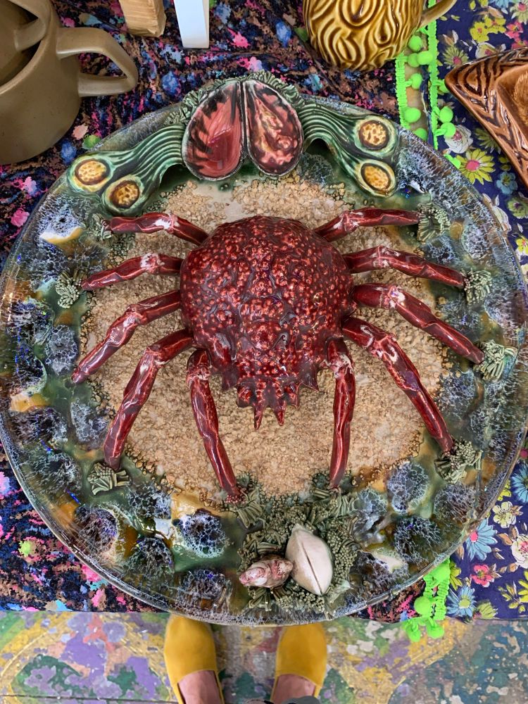 Ceramic plate featuring a fully 3d life size crab in the middle of it