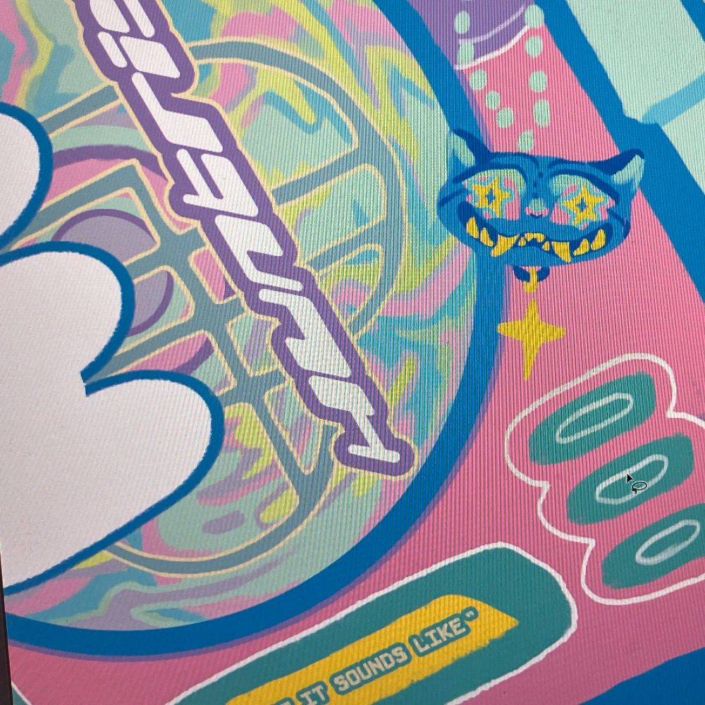 pastel cd player, a holographic cd spinning inside. Next to it is blue tiger charm 