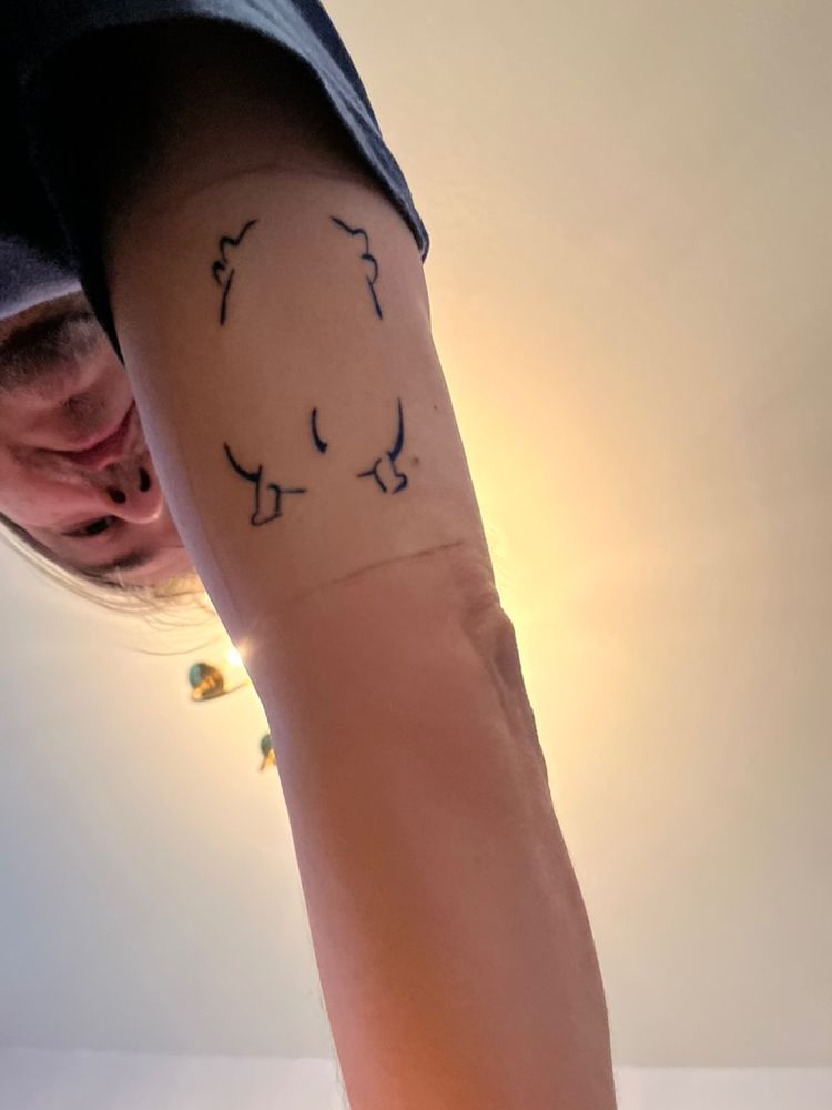 the back of a moopsie as a tattoo.