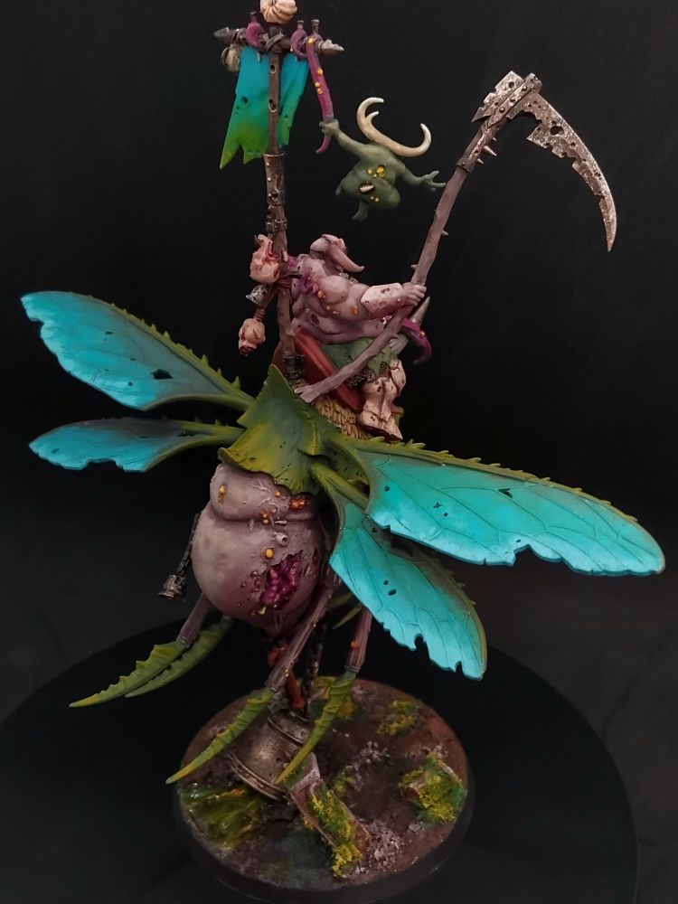 Corpulent figure with a scythe on the back of a large winged insect