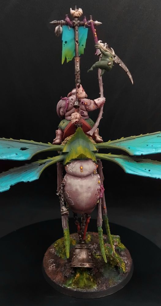 Corpulent figure with a scythe on the back of a large winged insect