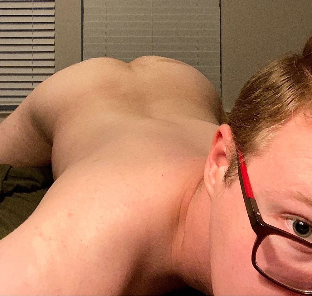 A selfie of me arching my back and showing off my ass