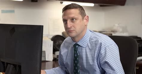 Picture from the Nude Egg sketch from the Netflix show “I Think You Should Leave.” In this picture, Tim Robinson is sitting at a computer in a generic looking office, looking up at co-workers who are talking to him from the doorway. 