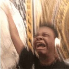 A kid listening to music and really enjoying it