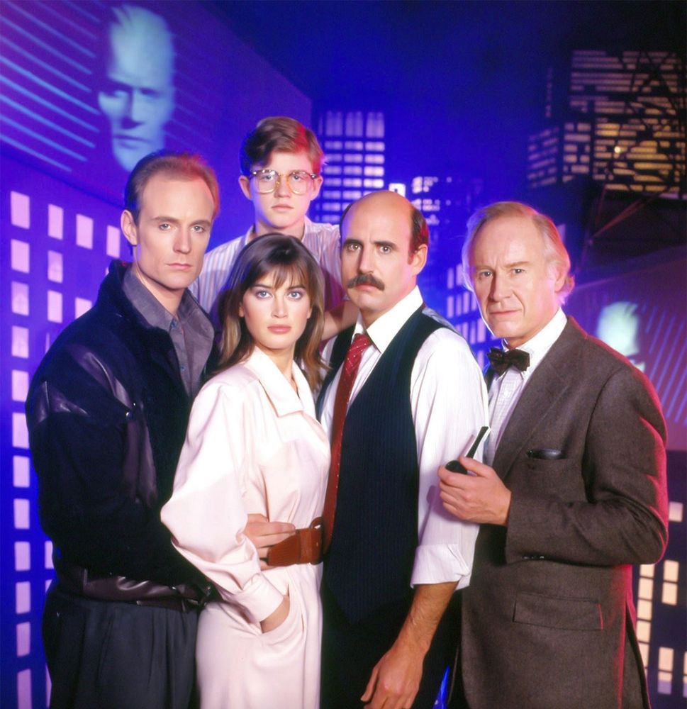 The main cast of the TV show Max Headroom, a collection of nerds, journalists and professionals with a taste for the absurd.