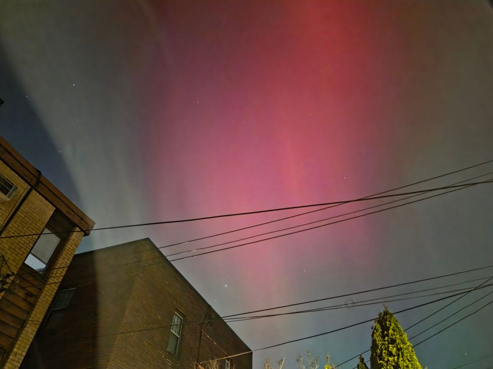 Red and green northern lights over Saint Paul

