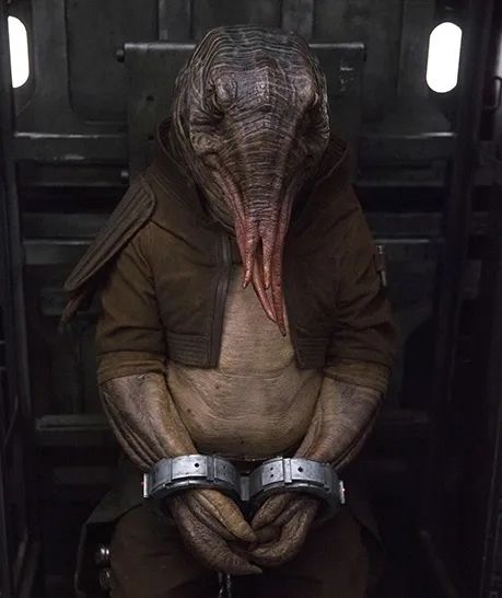 A tentacle-faced alien in manacles