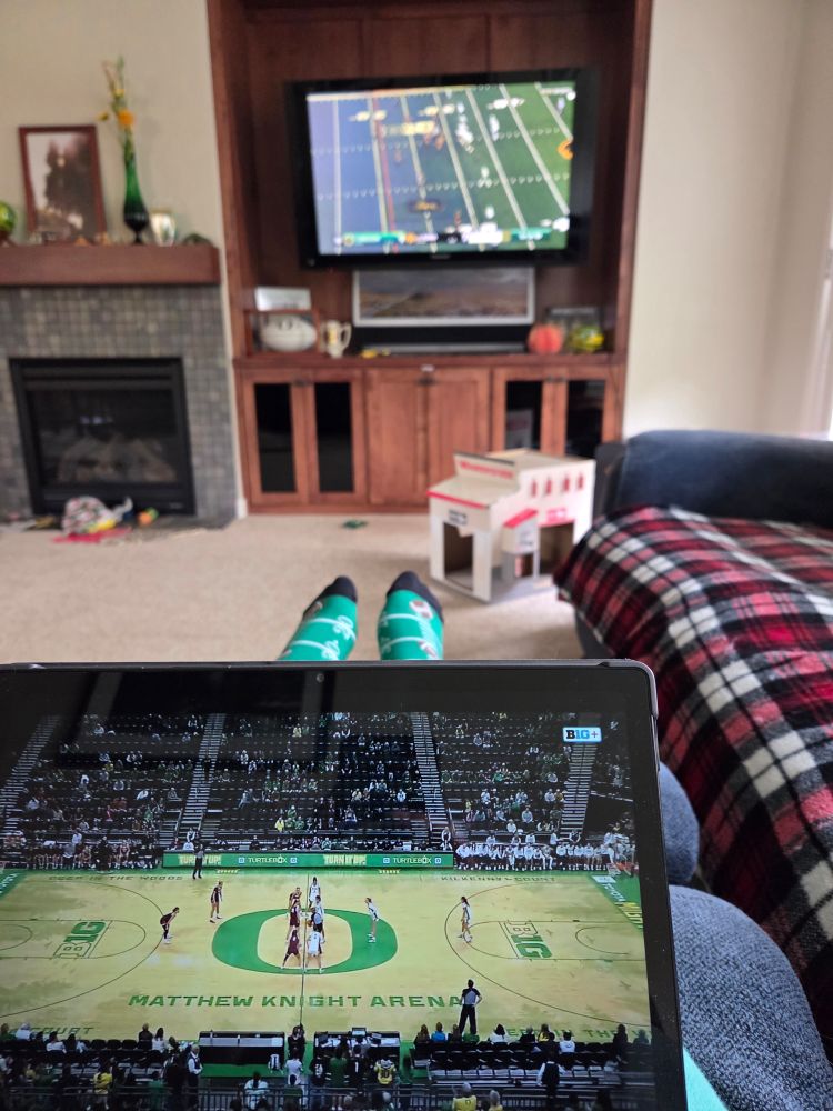 TV with football game and iPad with women's basketball game