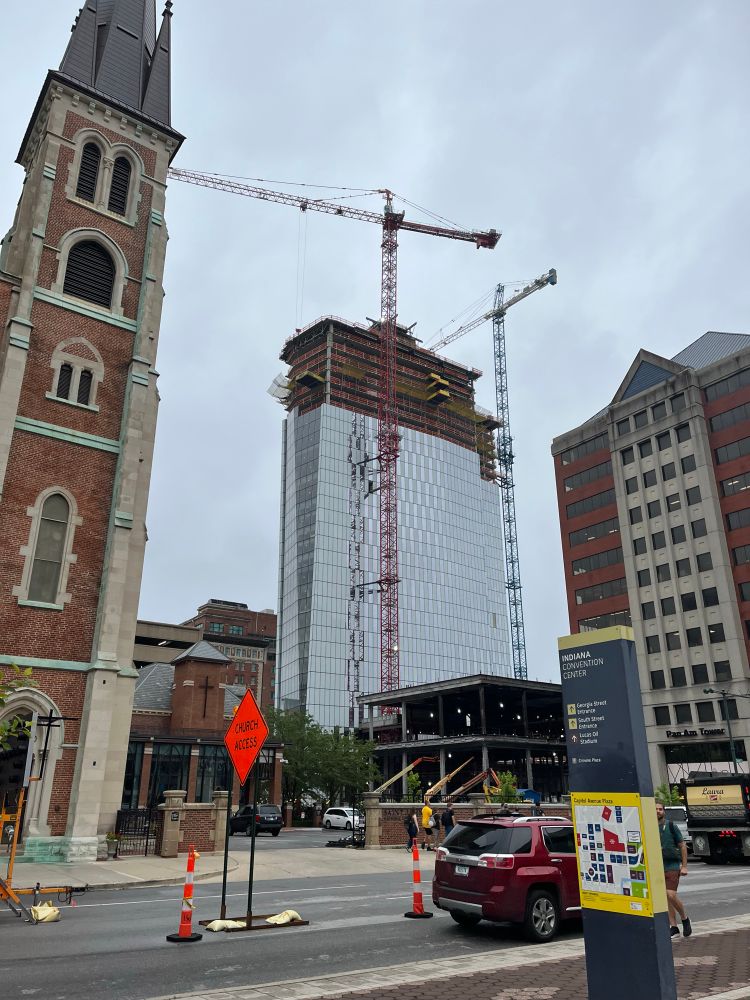 A picture of a hotel being constructed in Pan-Am plaza next to Gencon 2025