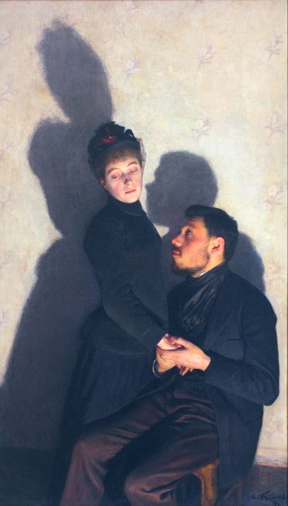 Two lovers; a man and a woman in black, she is standing, he is sitting, she is looking away, he is looking at her, he is holding her hand, they cast shadows onto the wall behind them. Painting.