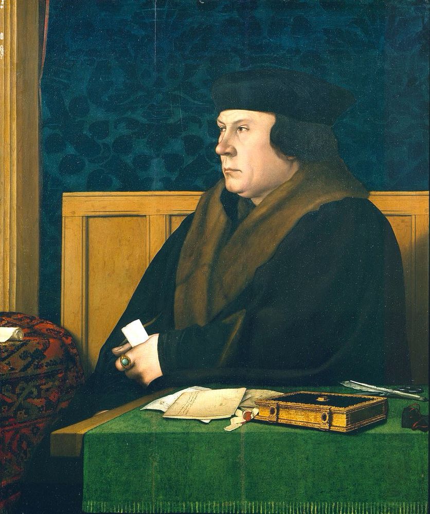Portrait of Thomas Cromwell by Hans Holbein the Younger, 1532–1533. Cromwell is seated at a table with a green cloth, papers, quill and book, he is holding a paper in his hand, he is wearing a black coat with brown fur collar and a black cap. Behind him is wood panelling and green wall covering. 
