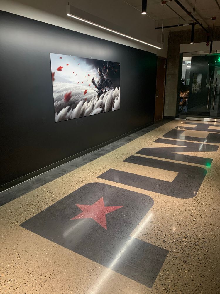 a poster of our key art finally going up in the lobby right after it was revealed in December 2019