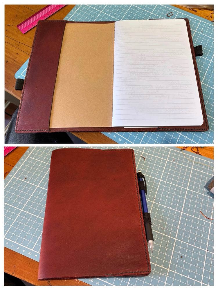 A red leather notebook cover, photographed from above. It’s kinda ok 