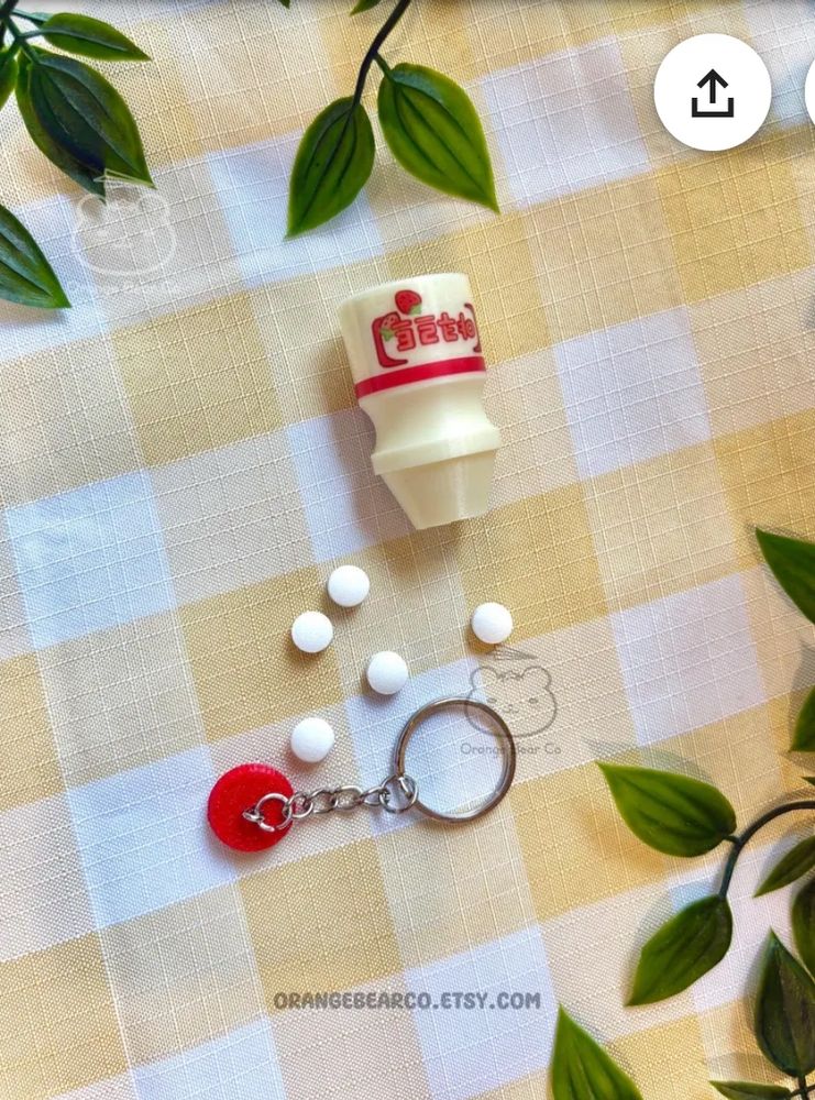 Picture of my yakult keychain that opens up to hold small items