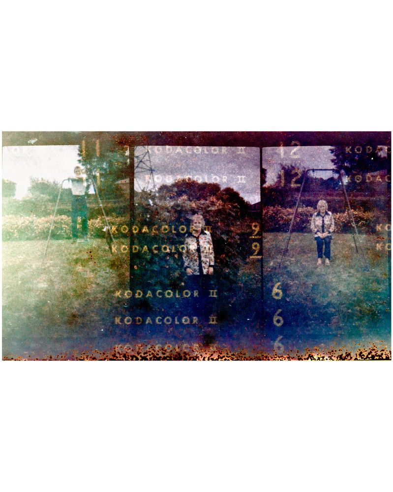 Very grainy film photos of a woman with curly hair and a shirt with 70s style lapels in a garden, embossed with the words kodacolor II from the paper backing of the expired film roll circe 1970s 