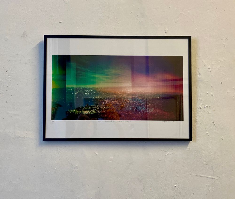 Framed print of a surreal seascape with shifting colours, misty spectres and floating horizons like fata morgana made from layered multiple exposures 