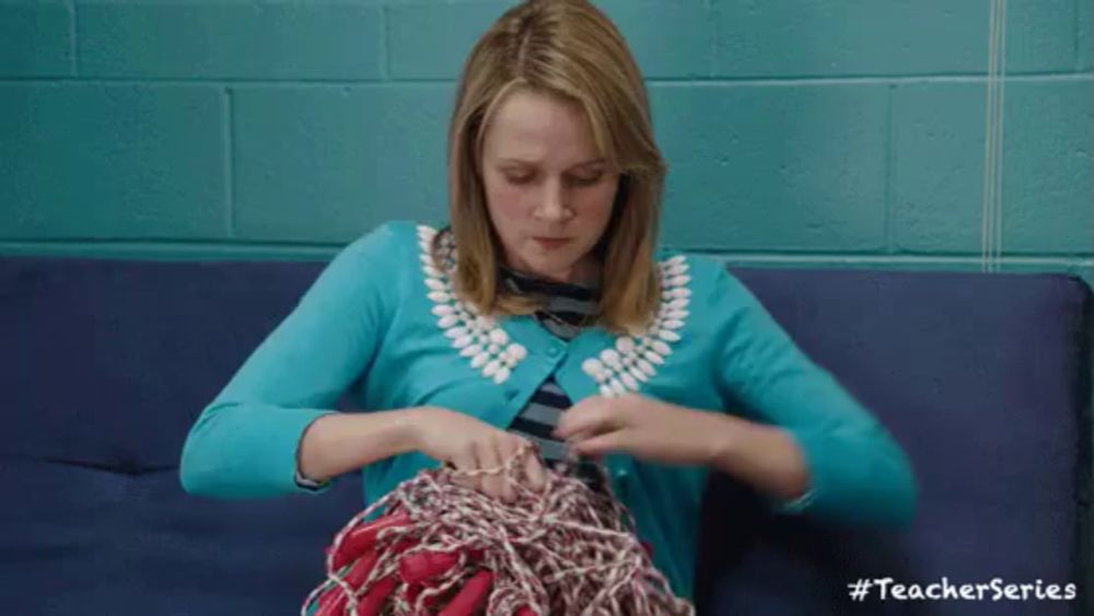 a woman is sitting on a blue couch knitting a sweater with the teacher series written on the bottom