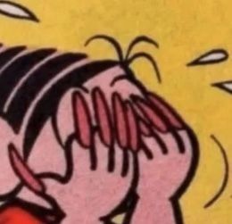 Mônica com unhas de acrigel longas e vermelhas e as mãos no rosto, emocionada.