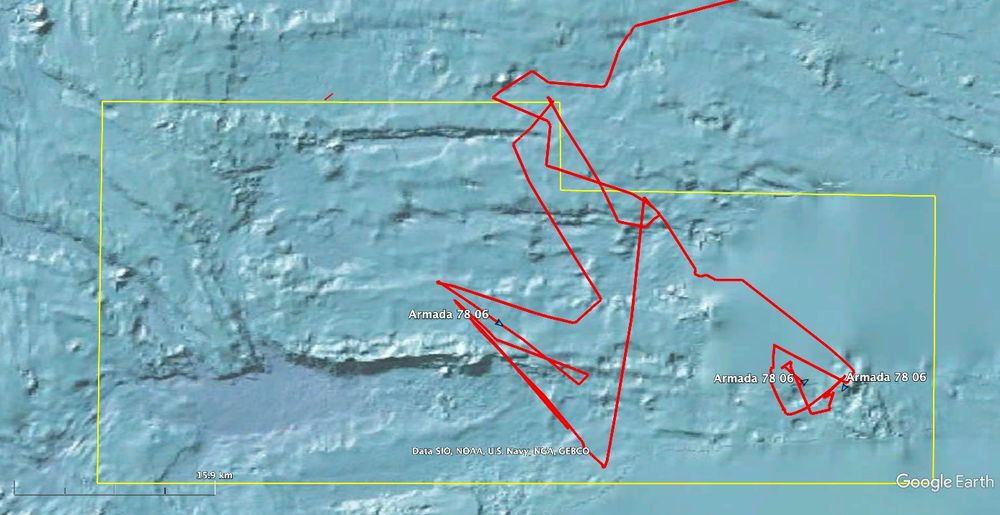 This image shows Armada 78 06 track (red) over the past three days. While the position is AIS derived, it is relayed via satellite & coverage is irregular thus sharp changes in direction may not be entirely accurate. The vessel track provides a proxy for AUV operations: the AUV launch, periodic comms/nav checks, & recovery can be discriminated as progress continues.  The area of interest bounded in yellow, showing the canyons & escarpments, lies to the east of vessel track with the AUVs traversing the area along track lines east-west. The bounded area is approx 1,500km²: consistent with 4 days mission carried out by 3 AUVs.