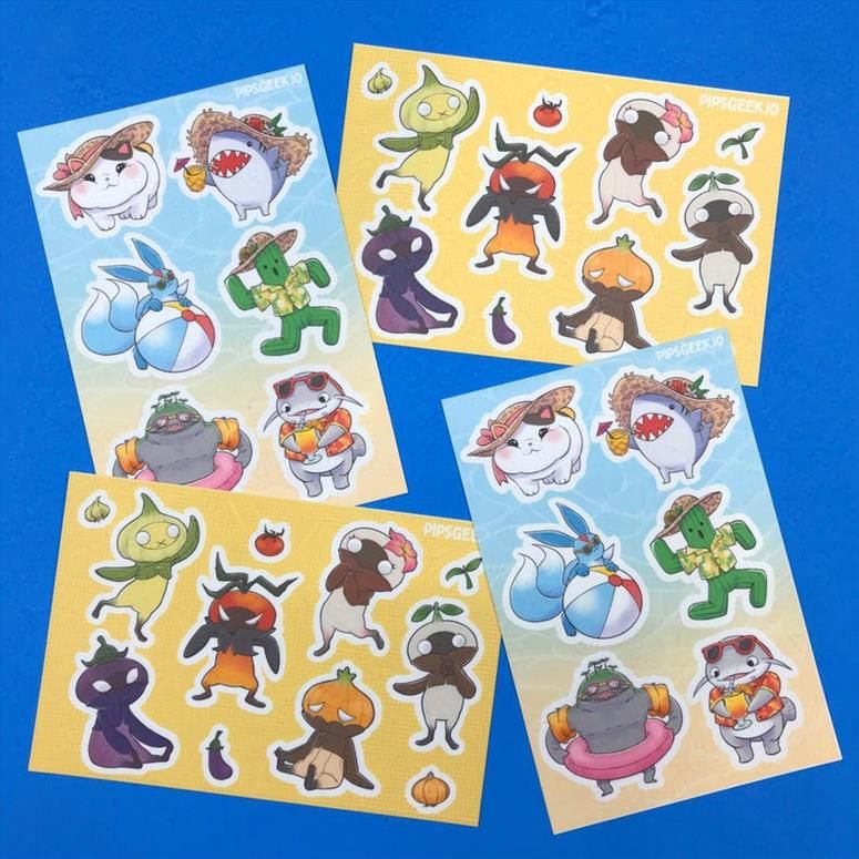 A photograph of two different sticker sheets featuring critters from FFXIV! One sheet is of the Mandragoora court, including the garlic jester, eggplant knight, onion prince, tomato king, kidragora, and mandragora queen. The other sticker sheet is of beach-going minions, including a fatcat in a straw suun hat, major general in a straw sun hat with a tiki drink, a carbuncle wearing shades with a beach ball, a cactuar in a hawiian shirt and sin hat, a gobbue wearing water swimmies and an innertube, and a namazu with shades and a hawaiian shirt with a drink.