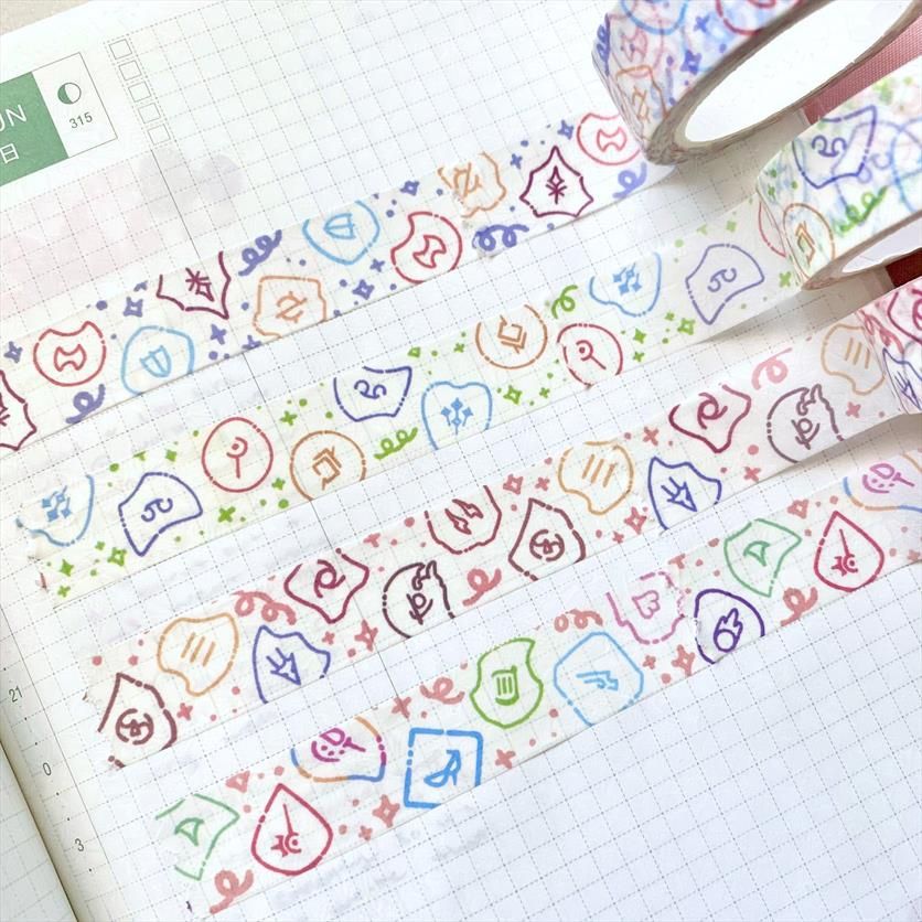 A photograph of four different washi tapes all using the same type of layout and kawaii illustration style. The design is of the FFXIV soul crystals drawn in colorful outlines, and each washi tape is separated by role: Healer, Tank, Melee DPS, and Ranged & Caster DPS.