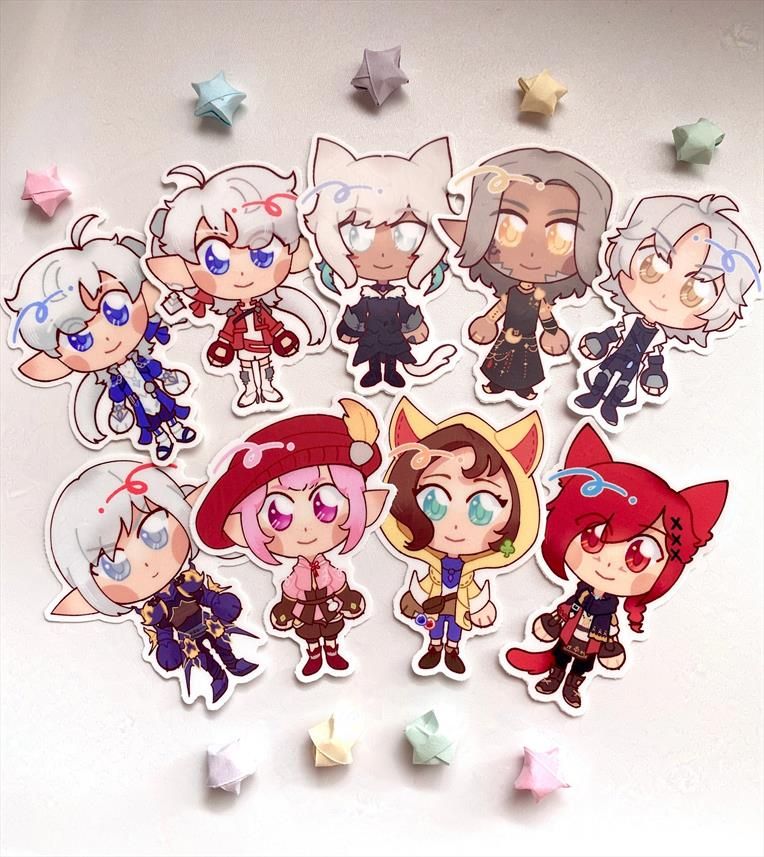 A photograph of a series of stickers illustrated in a chibi style of FFXIV scions. The characters included are ALphinaud, Alisae, Y'shtola, Urianger, Thancred, Estinien, Tataru, Krile, and G'raha. 