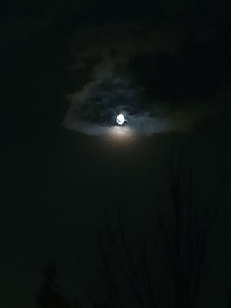 Gibbous Moon through clouds. Lousy tablet photo. 
