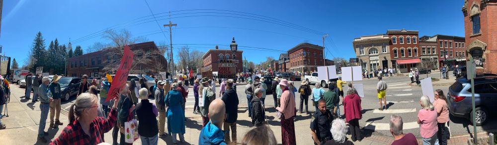 May Day protest in Belfast, Maine: nice folks spending their lunchtime standing up for workers and democracy with hand written signs in a five way intersection